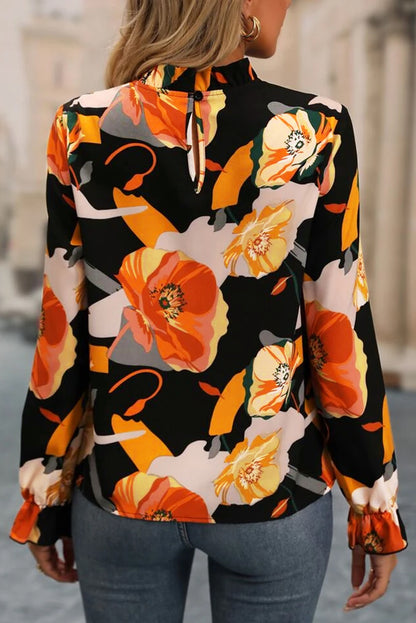 Blusa con cuello simulado y estampado floral negra