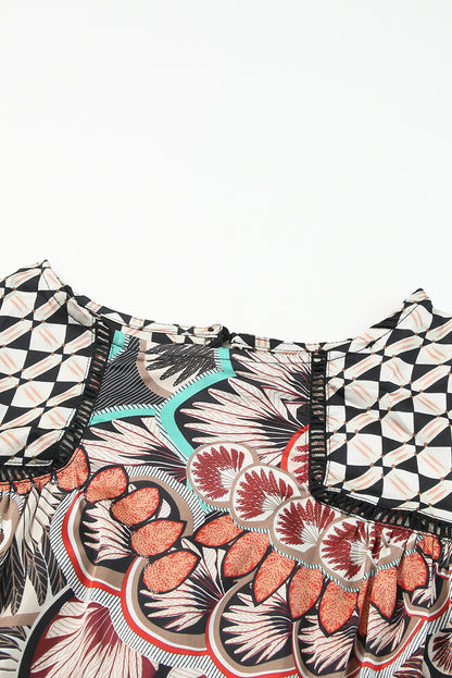 Blusa manga larga con volantes y estampado geométrico floral mixto negro