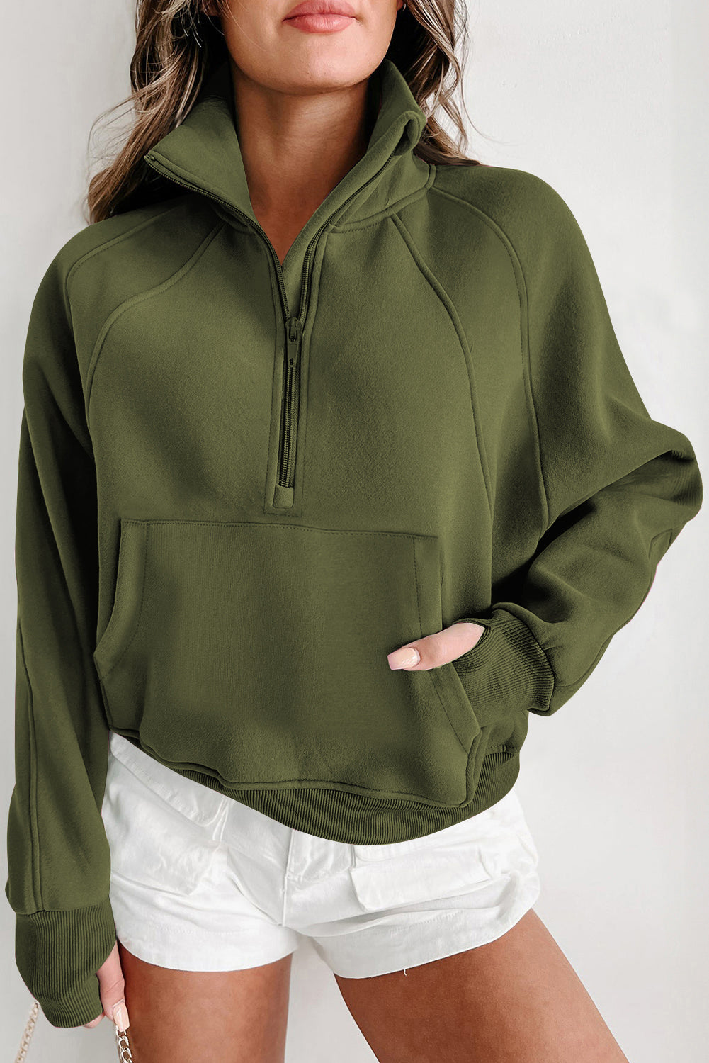 Sudadera con cremallera y cuello alto con manga acanalada y abertura para el pulgar en verde