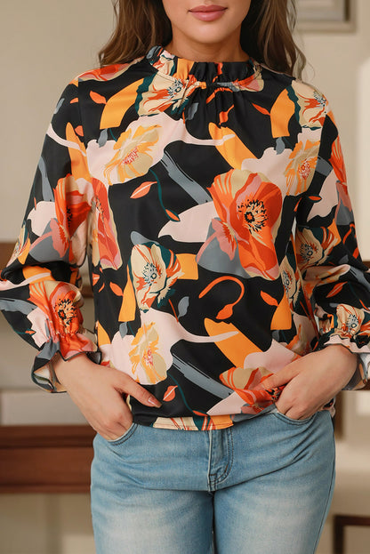 Blusa con cuello simulado y estampado floral negra